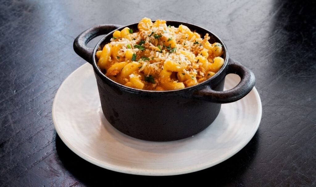 Smoked gouda mac and cheese in an individual iron dish.