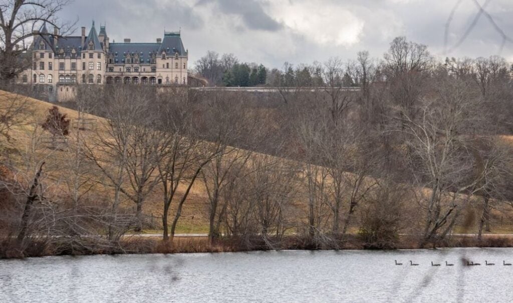 West side of Biltmore House above the Lagoon with ducks on the water