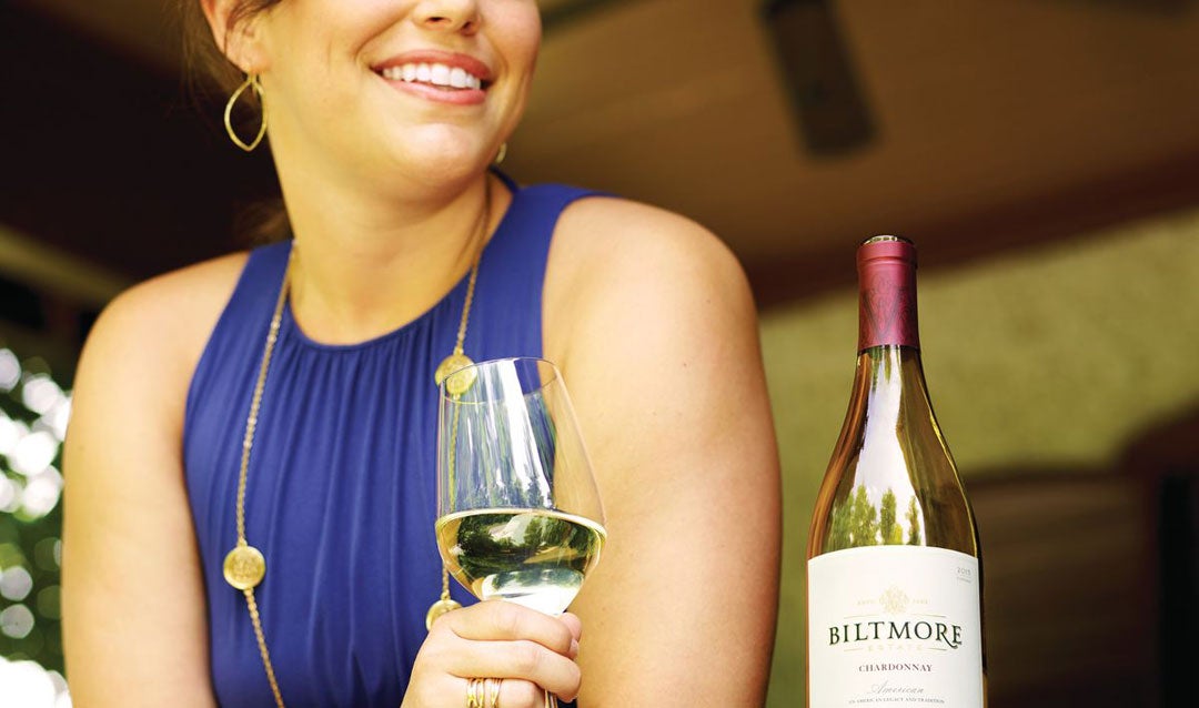 Woman enjoying Biltmore Estate Chardonnay