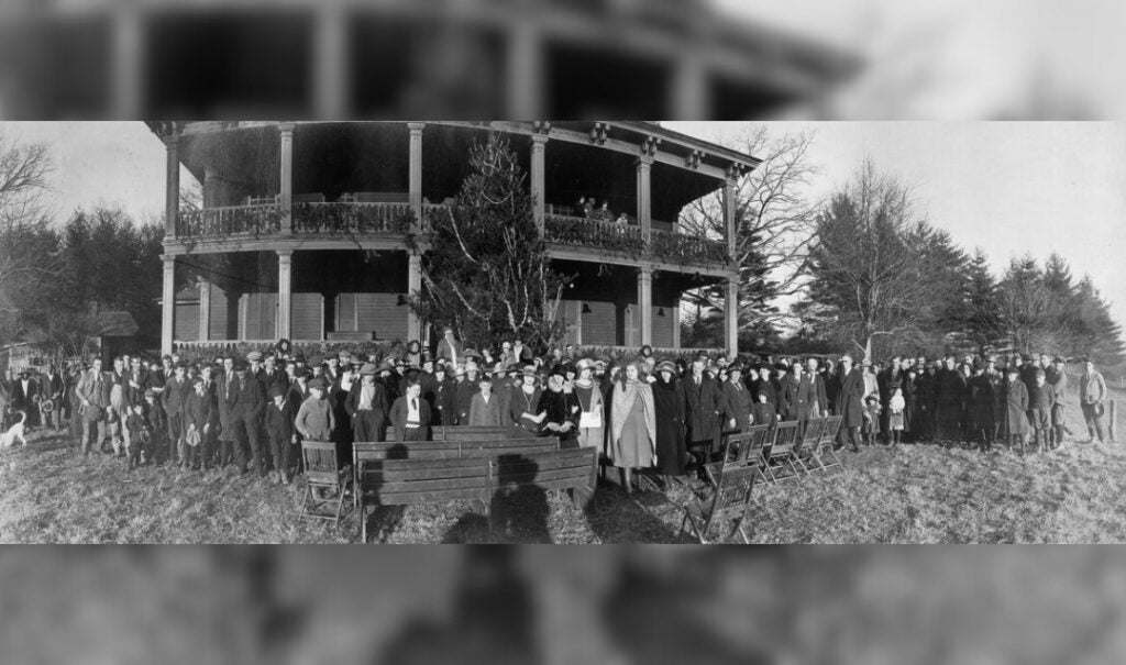 Biltmore employee Christmas party held at Antler Hall in 1916 (Edith Vanderbilt is right of center in a black hat; Cornelia Vanderbilt is on her left in a light-colored hat)