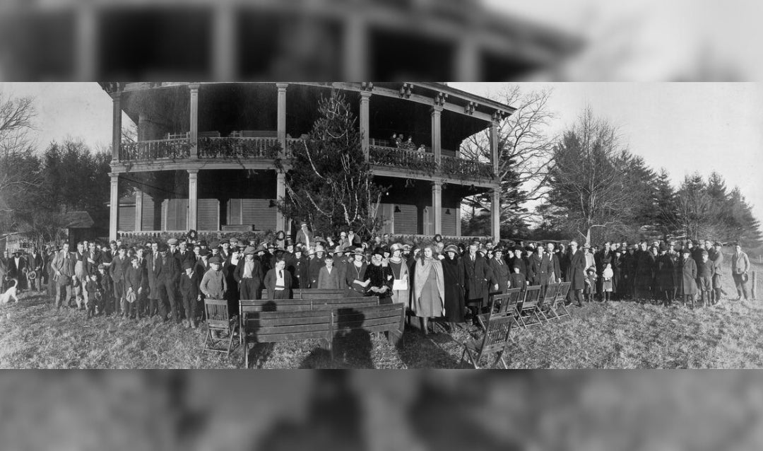 Biltmore employee Christmas party held at Antler Hall in 1916 (Edith Vanderbilt is right of center in a black hat; Cornelia Vanderbilt is on her left in a light-colored hat)