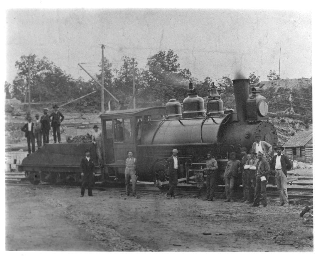 Archival photo of some of the workers and a steam engine that built America's Largest Home