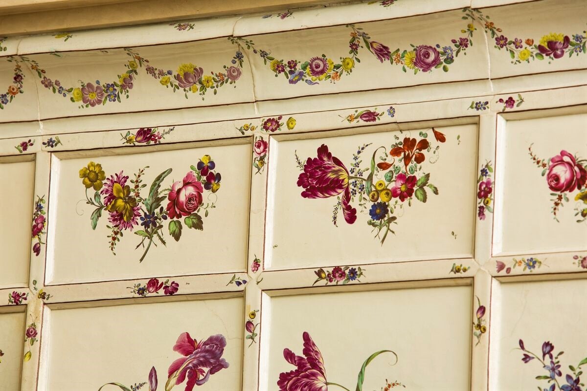 Detailed view of the tile over-mantel in the Tyrolean Chimney Room