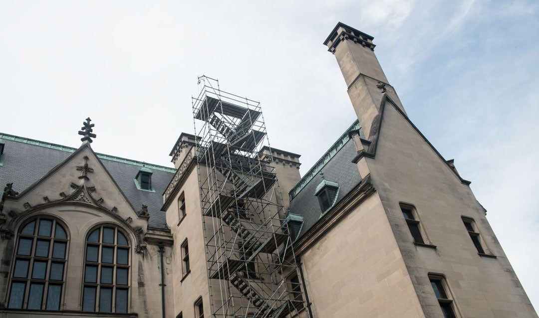 Scaffolding in place to access North Tower Ridge Cap restoration on roof of Biltmore House