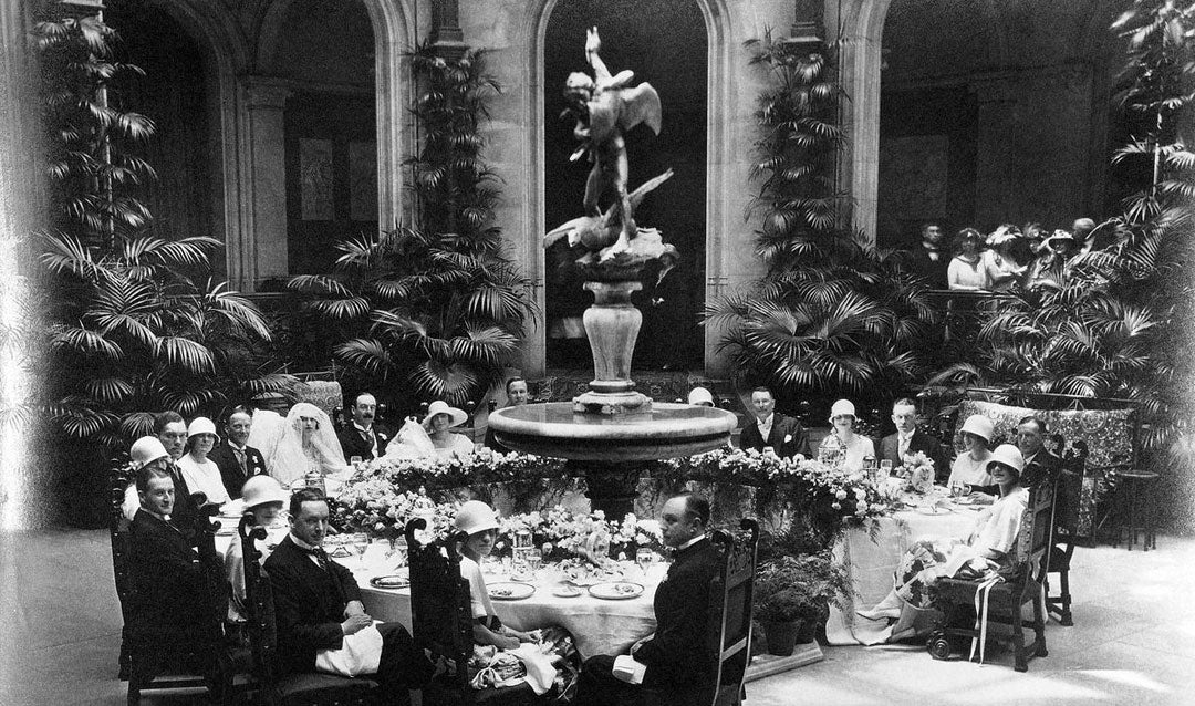 John and Cornelia Cecil wedding party at breakfast in the Winter Garden of Biltmore House