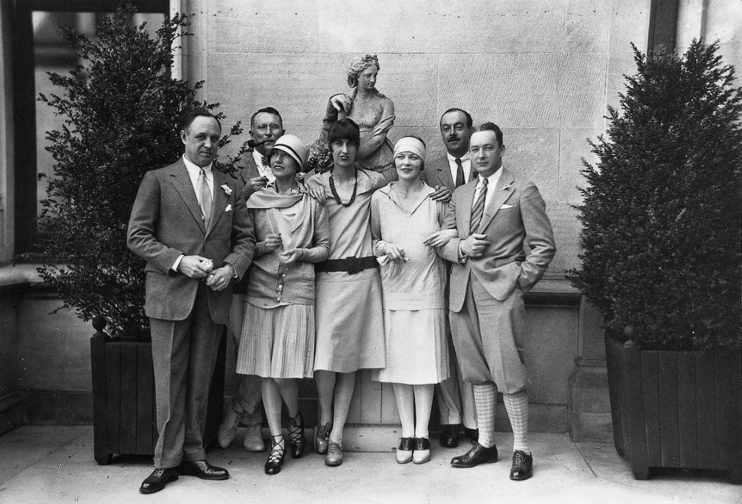 Cornelia Vanderbilt (front center) and John Cecil (back right) at party with friends in front of Biltmore House, 1925