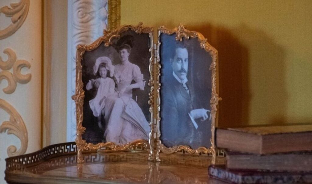 Framed photographs of Edith and Cornelia Vanderbilt (left) and George Vanderbilt (right)