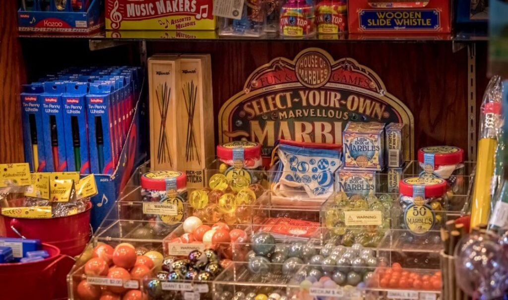Old-fashioned marble game and other toys on display.