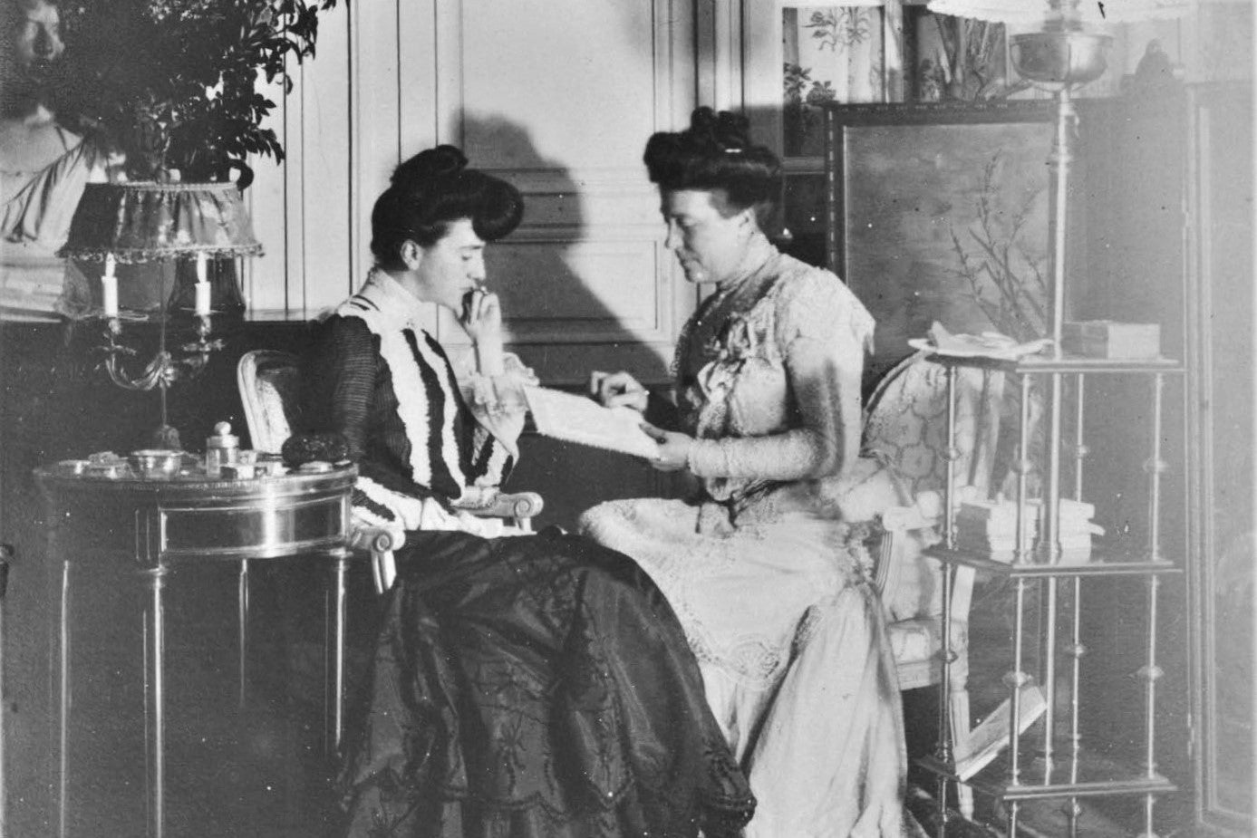 Edith and her eldest sister Susan doing needlework, ca. 1890 (cropped)