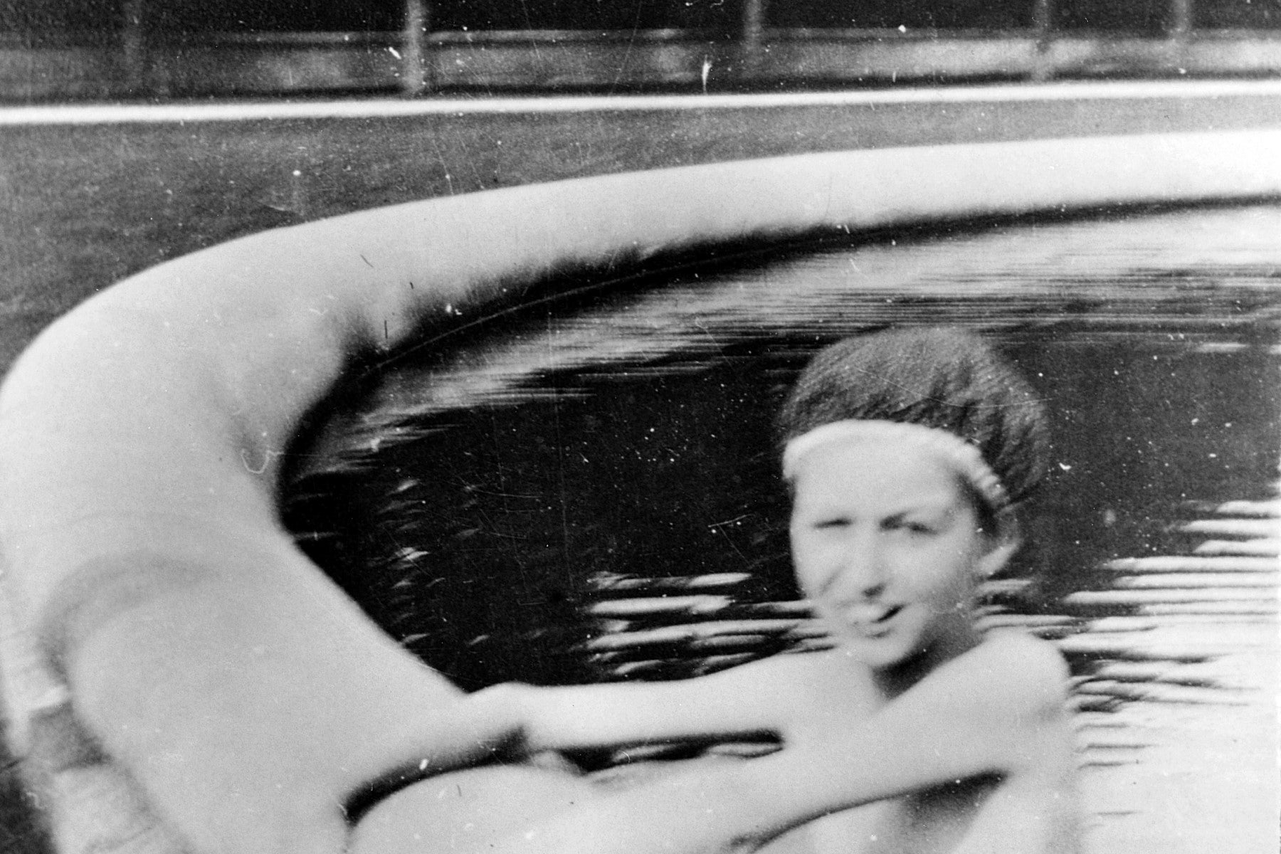 Cornelia Vanderbilt swimming in the fountain at Biltmore on a summer day.