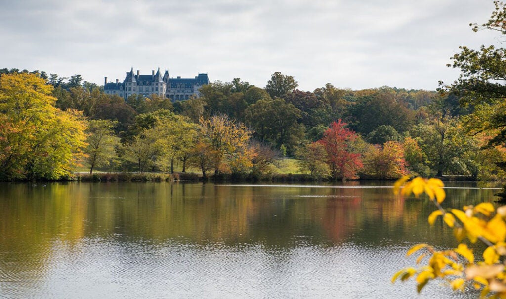 West side of Biltmore House view from Lagoon with fall color.