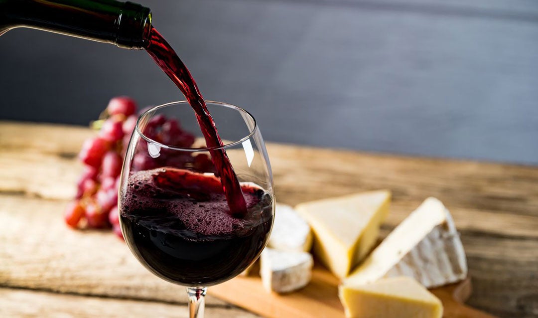 Aromatic red wine being poured