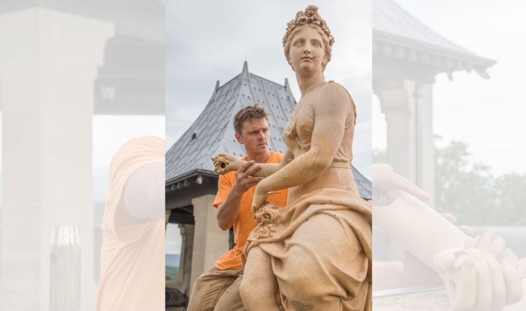 Irvine works with the statue on the South Terrace of Biltmore House.