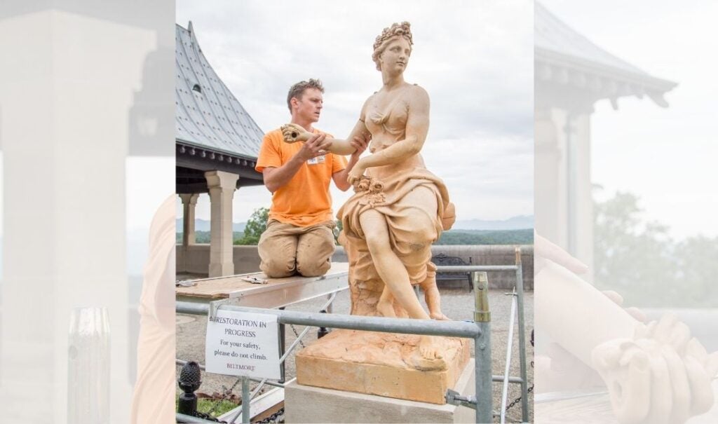 A restoration sign communicates the importance of the artist's work on the statue of Flora.