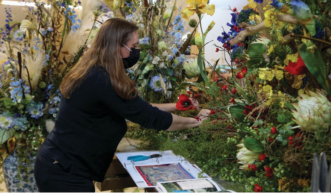 A Biltmore floral designer creates an arrangement for the Banquet Hall