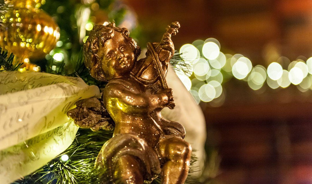 Golden cherub ornament on a Biltmore Christmas tree