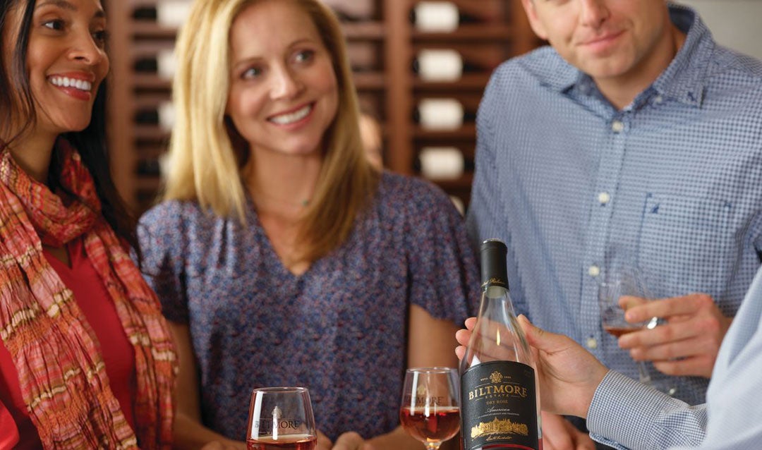 Guests enjoying a wine tasting at Biltmore Winery
