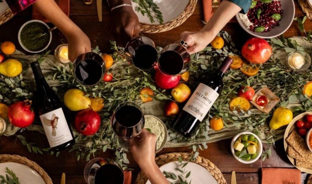 Overhead photo of a table set with Biltmore wines and a fruit-covered garland.