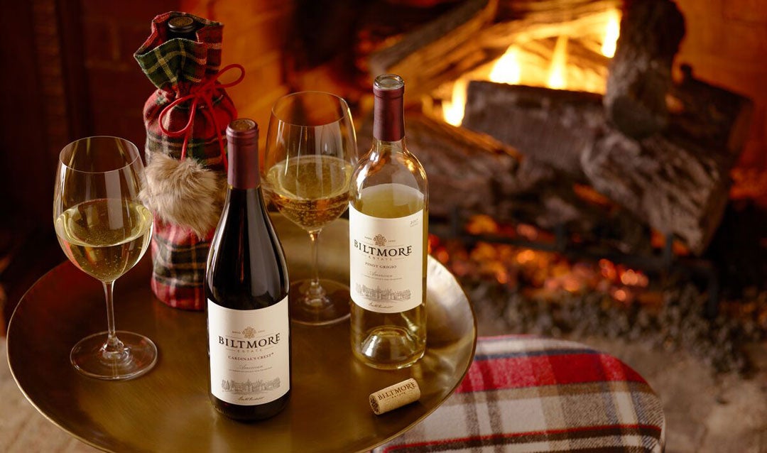 Biltmore wines in front of a fireplace