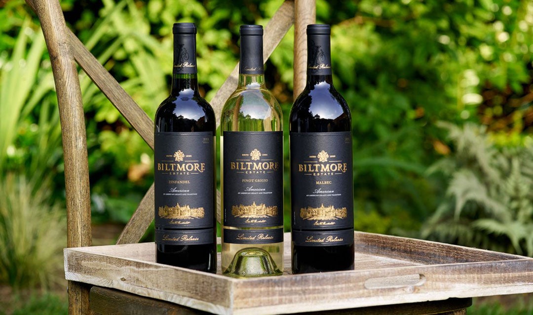 Three bottles of Biltmore Estate Limited Release wine on a chair