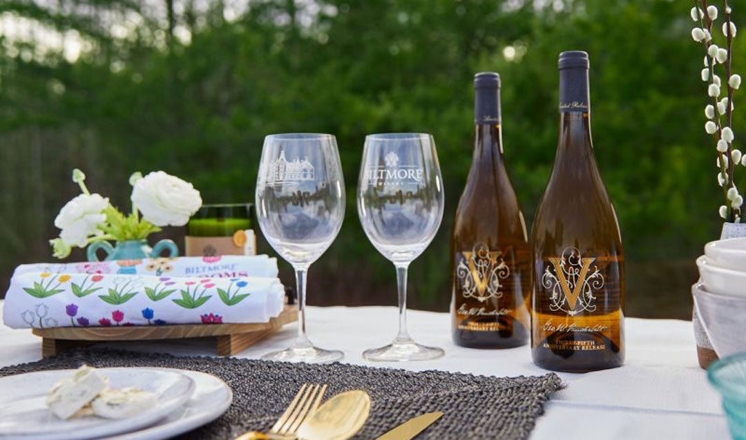 Biltmore Winery 35th Anniversary Chardonnay on a table with glasses