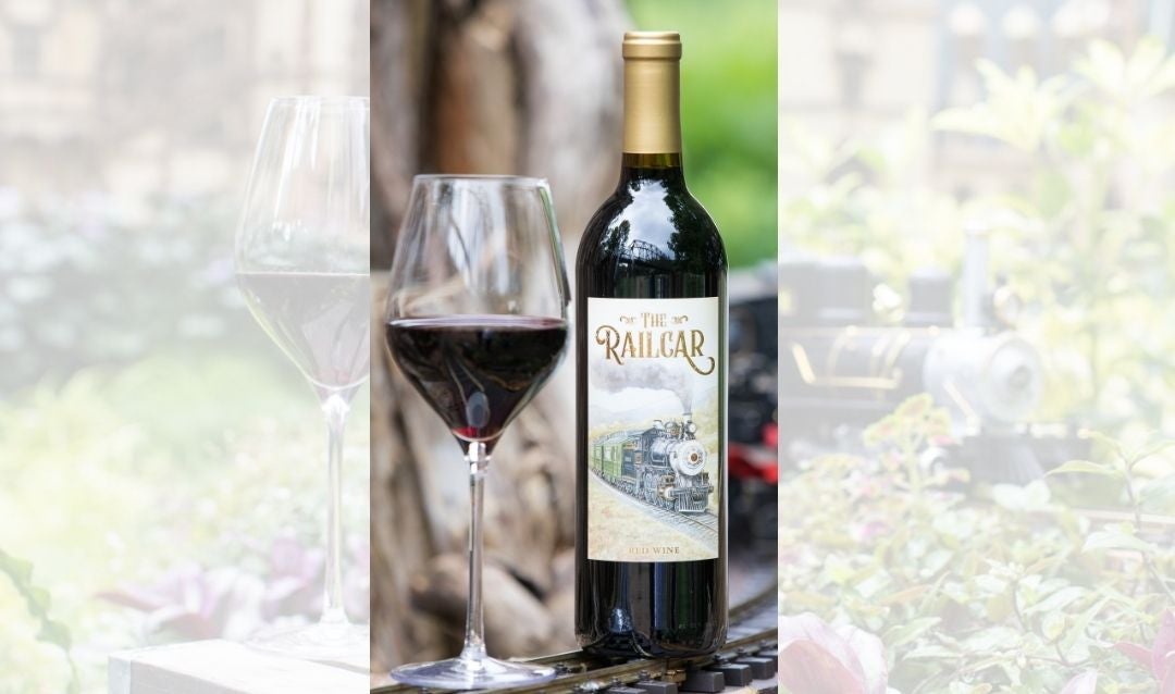 A bottle and a glass of The Railcar Red Wine.