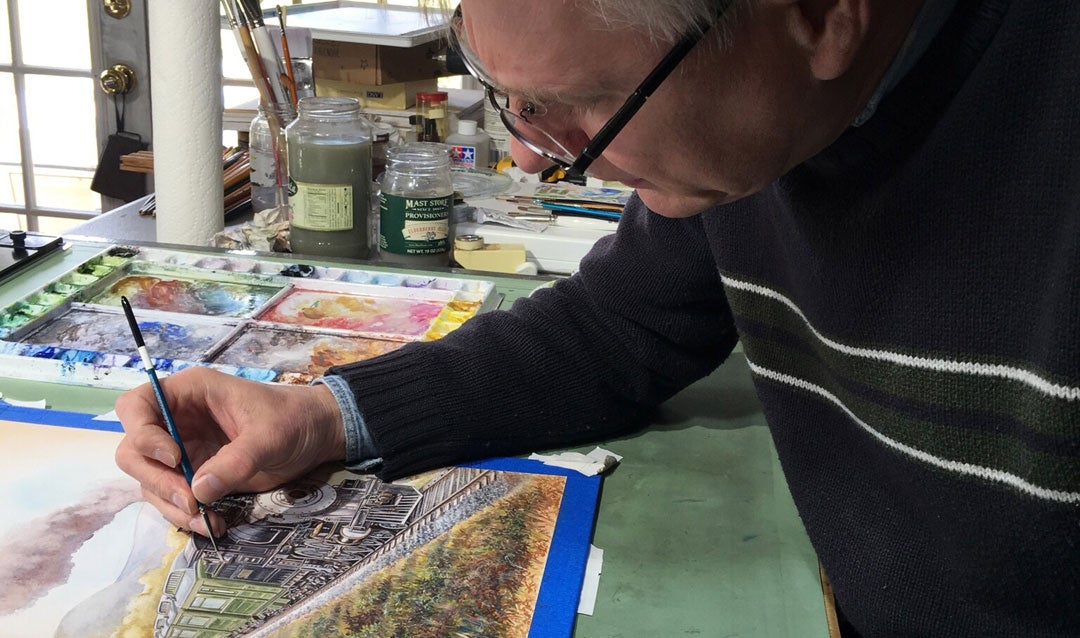 The artist at work on the label in his studio