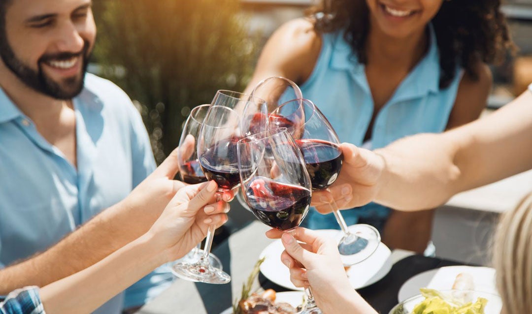 Friends toasting with red wine