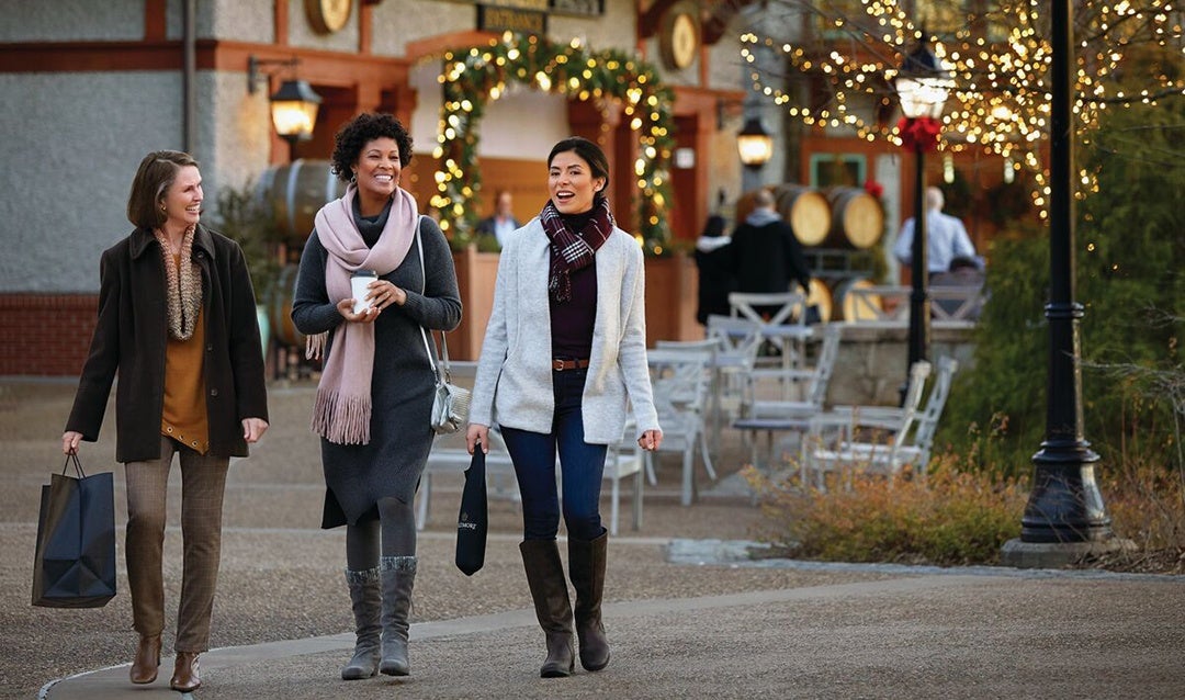 Three women shopping during Christmas time