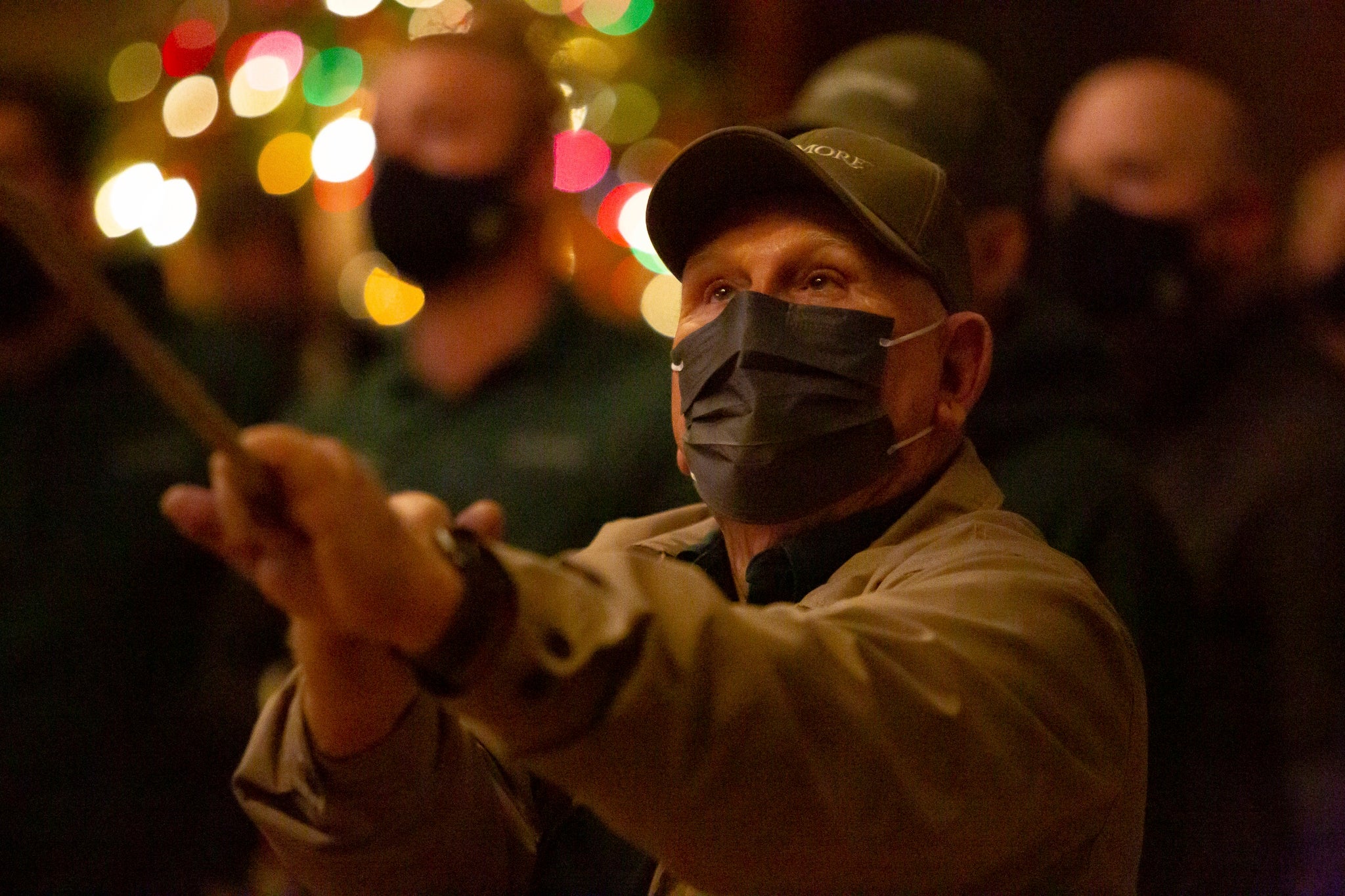 Man in Biltmore hat helps raise the Banquet Hall Christmas tree