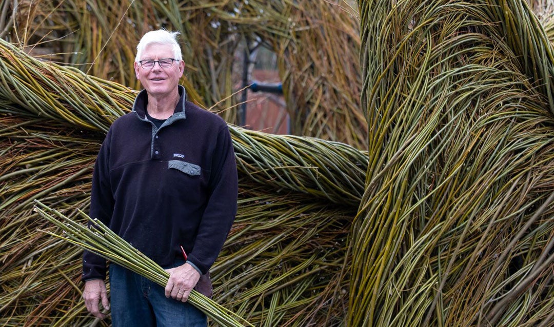 Patrick Dougherty with his Stickwork creation for Biltmore