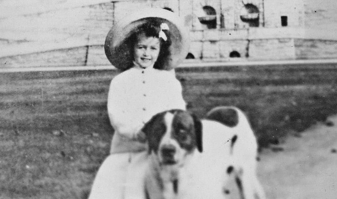 Cornelia Vanderbilt with one of her family's Saint Bernards on the Front Lawn of Biltmore House, 1905