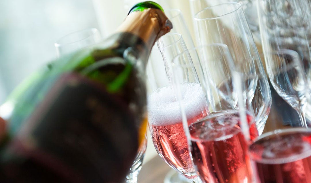 Biltmore Estate Blanc de Noir sparkling wine being poured in glasses.