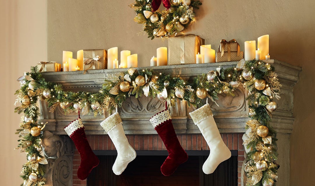 Holiday decor: Biltmore Gilded Stockings hanging on a mantel