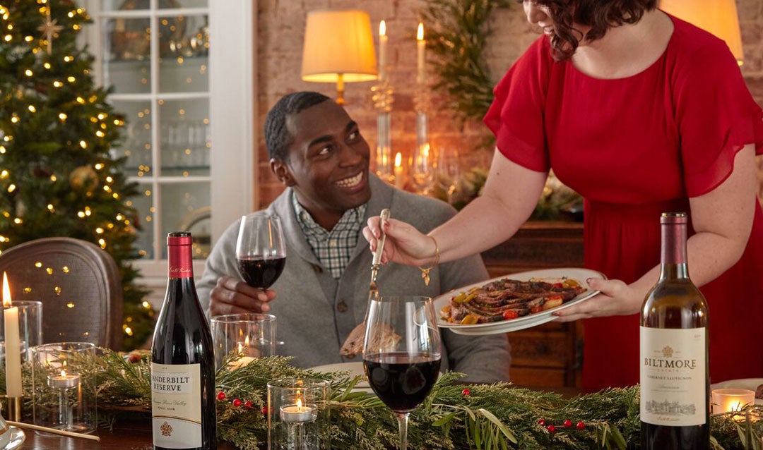 Man holding a glass of red wine