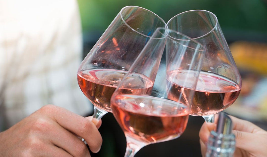 Toasting with glasses of rosé