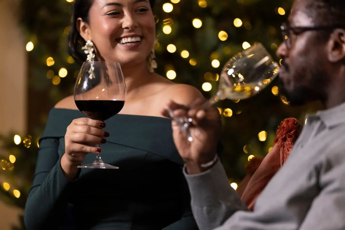 Man and woman with glasses of wine.