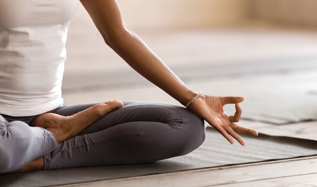 Woman practicing mindfulness with yoga