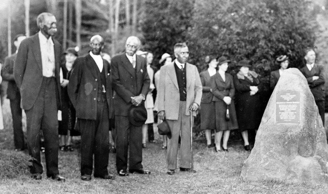 Photograph of the Azalea Garden ceremony on April 1, 1940. These men are presumed to be the four Black men recognized for their service on this day: Charlie Lytle, James 