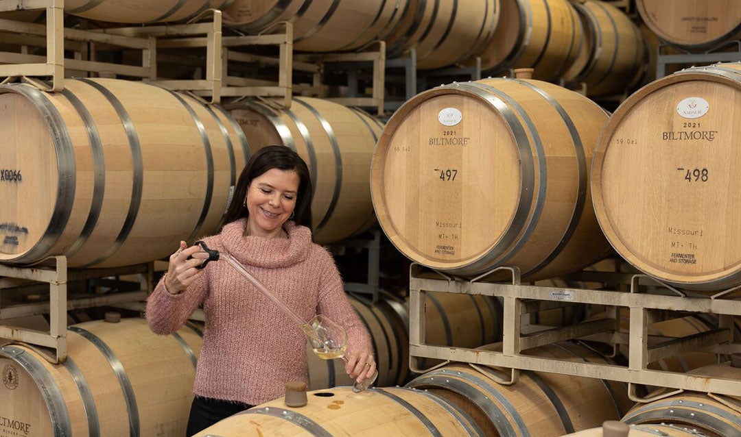 Sharon Fenchak, Biltmore Winemaker, with a syphon