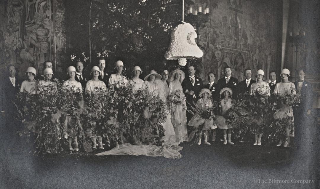 Portrait of the Honorable and Mrs. John F.A. Cecil’s wedding party inside the Tapestry Gallery, c. 1924