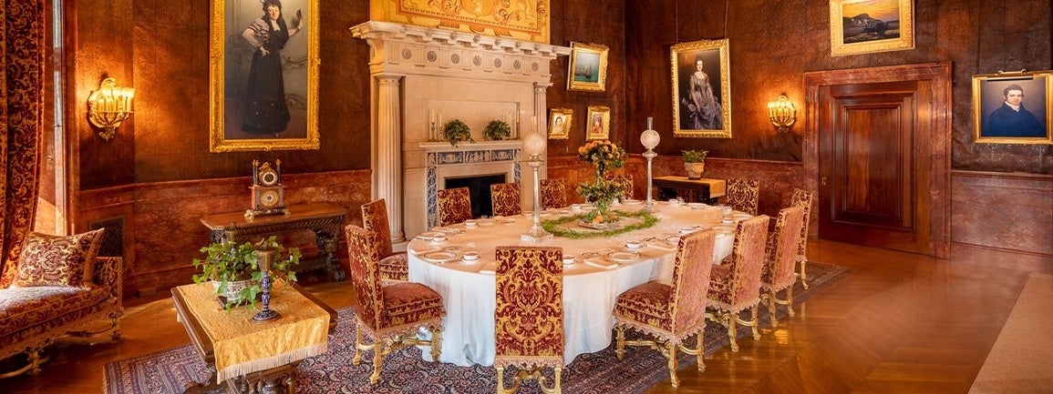 Biltmore House Breakfast Room features a fireplace and George Vanderbilt’s collected artwork. 