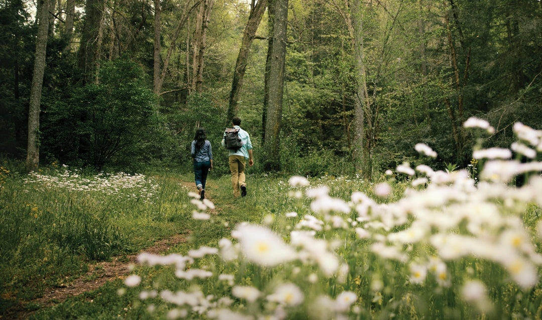 Couple hiking in Biltmore's 8,000-acre backyard