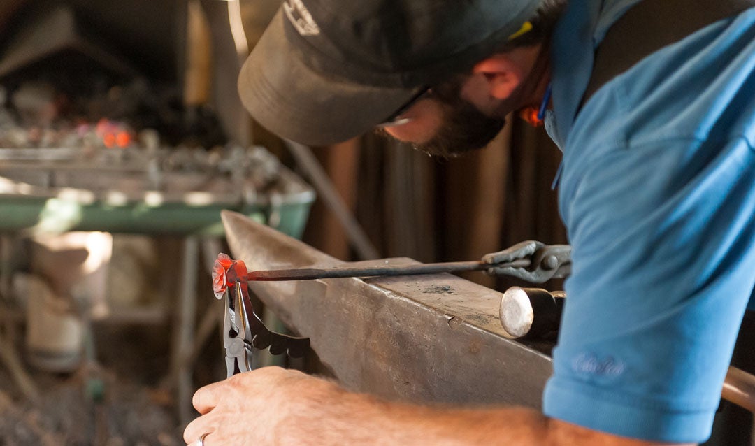 Steve peels back the petals of the roses using pliers while the metal is still red-hot to create the blooming effect.