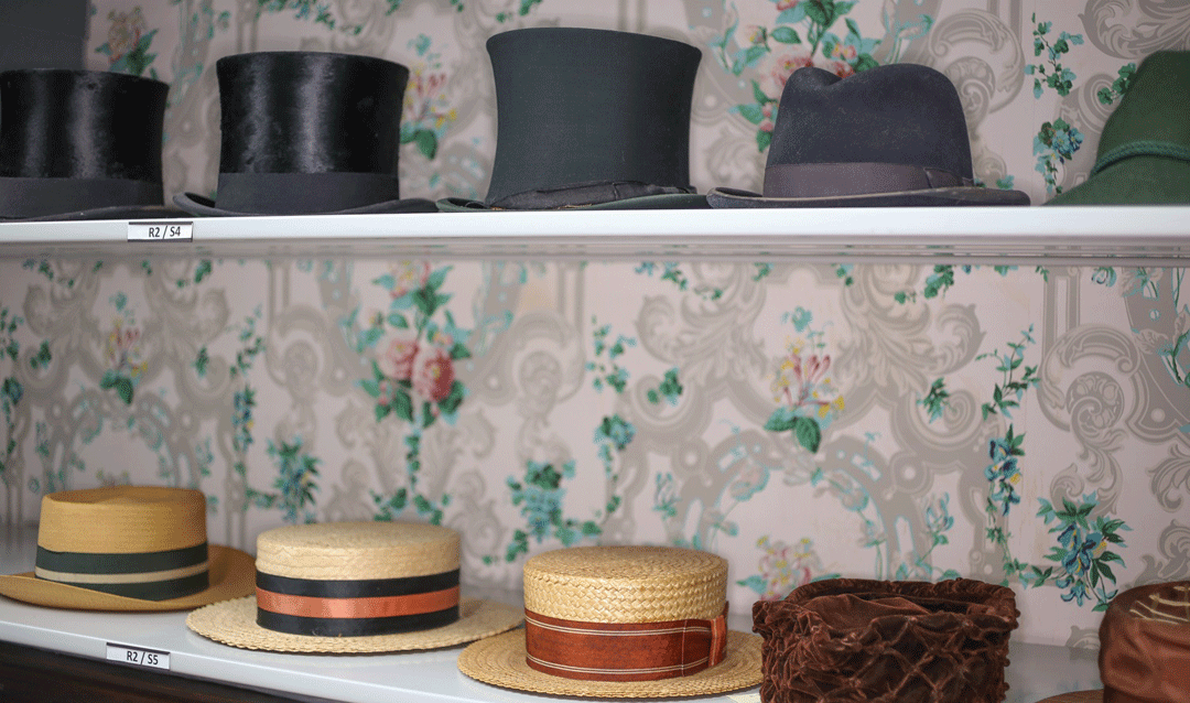 Top hats and casual hats stored in the Old Rose Room at Biltmore