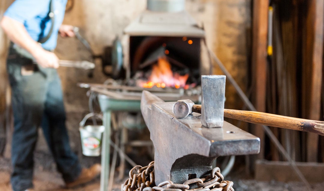 Blacksmiths use a variety of tools such as a hammer, an anvil, and a hot cut, which helps create indentations in the metal.