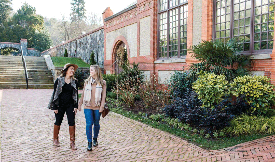 Two women in front of the Conservatory at Biltmore