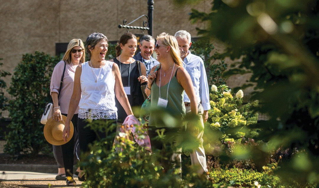 A group of men and women enjoy a friends' getaway at Biltmore
