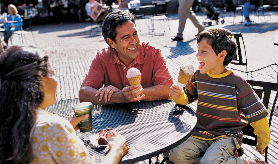 A family enjoying ice cream in the Stable Courtyard at Biltmore