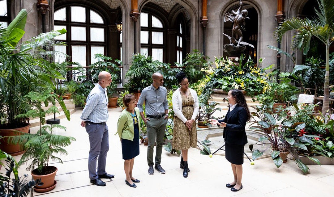 One of our Biltmore Interpretive Hosts leads a small group tour in the Winter Garden